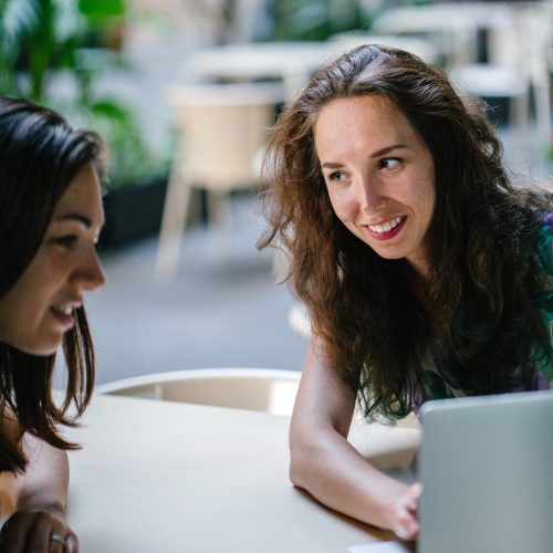 two-talking-women-while-using-laptop-1311547 (1)